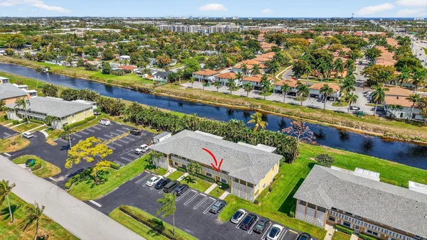 an aerial view of residential houses with yard