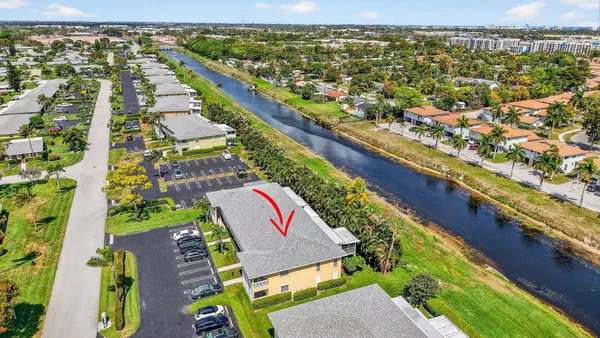 a view of a street with a large tree