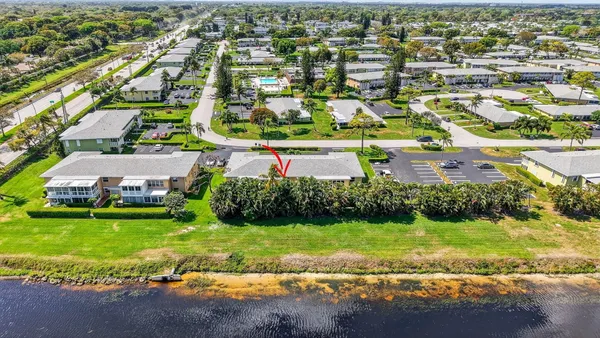 a room with pool table and windows