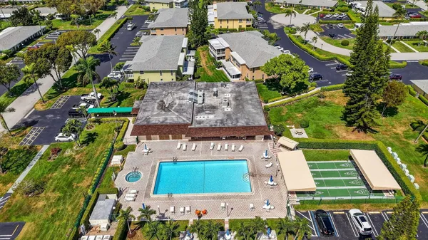 a view of a swimming pool with a yard