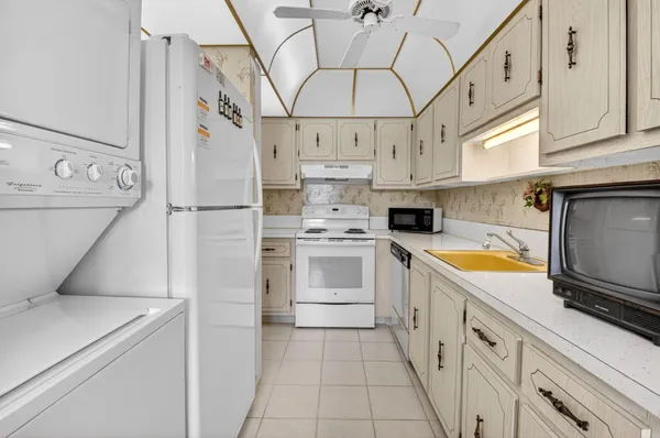 a view of a workspace with furniture and a flat screen tv