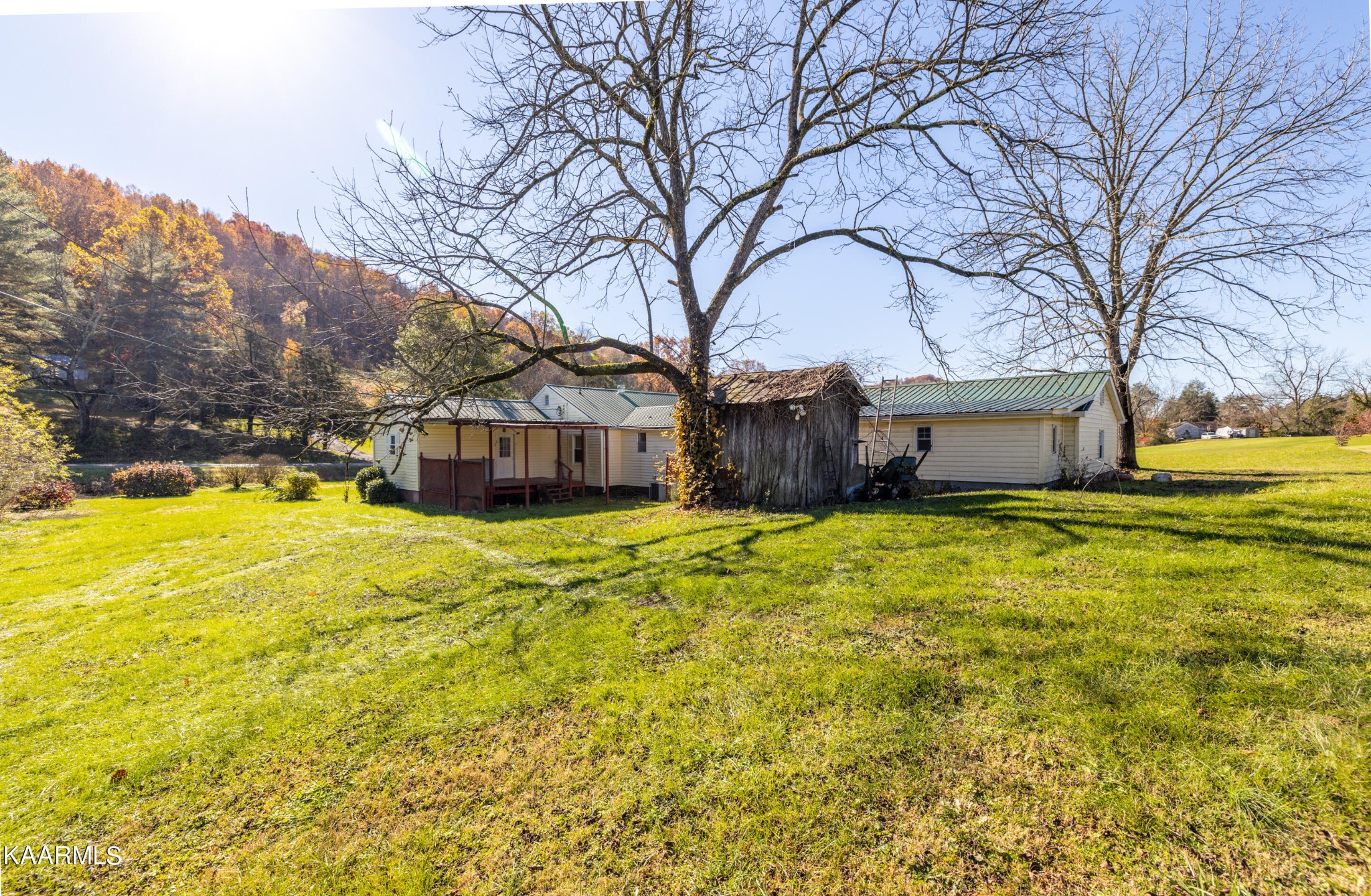 372 Raccoon Valley Road, Unit 1 Maynardville, TN 37807 - Photo 32 of 42 a front view of house with yard and trees