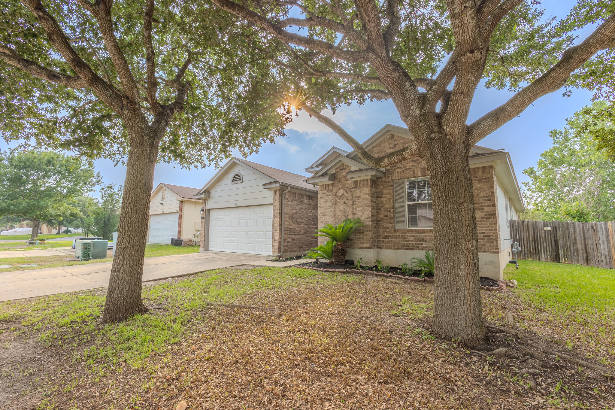 208 Discovery Kyle, TX 78640 - Photo 2 of 31 Brick facade home featuring a gabled roofline and attached garage