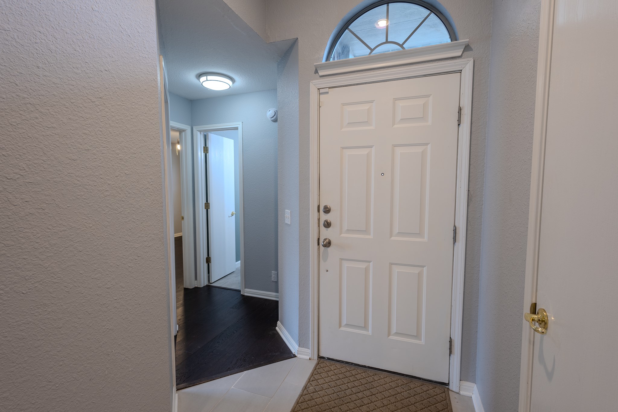 208 Discovery Kyle, TX 78640 - Photo 6 of 31 Entryway featuring a paneled door with an arched transom window