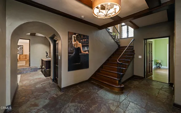 a living room with furniture a fireplace and a large window