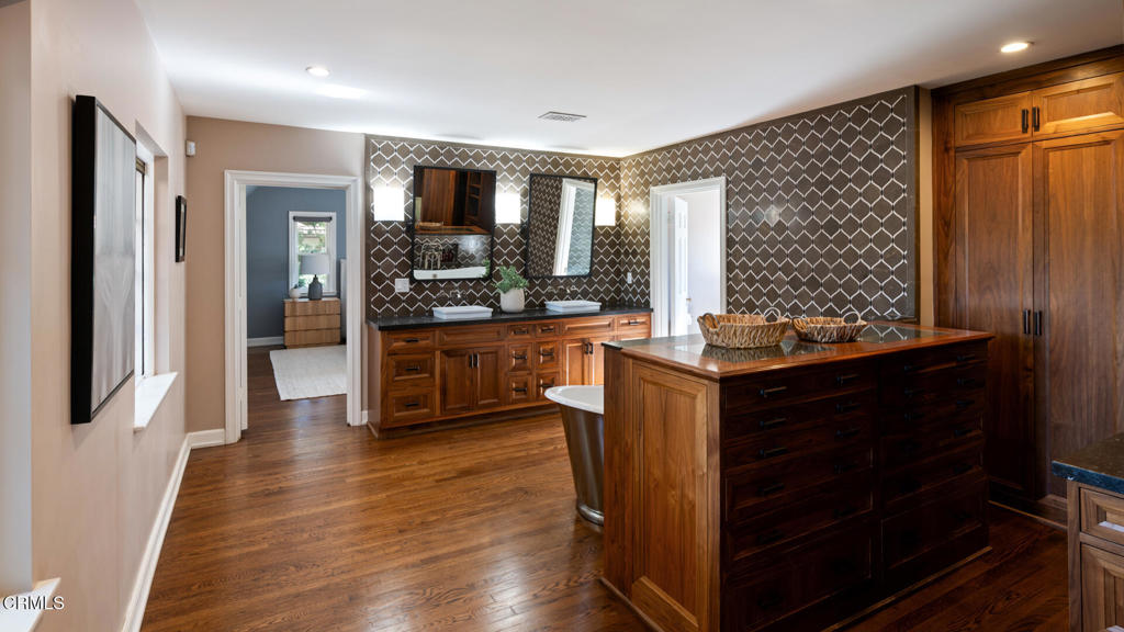 1146 Shenandoah Road San Marino, CA 91108 - Photo 22 of 38 a kitchen with granite countertop stainless steel appliances and wooden cabinets