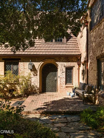 a front view of a house with garden