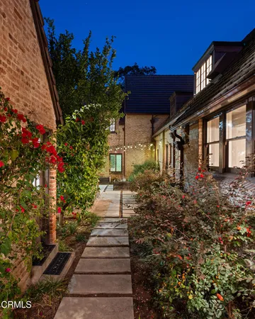 a view of house with patio outdoor seating