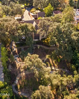 a wooden bench sitting in the middle of a yard