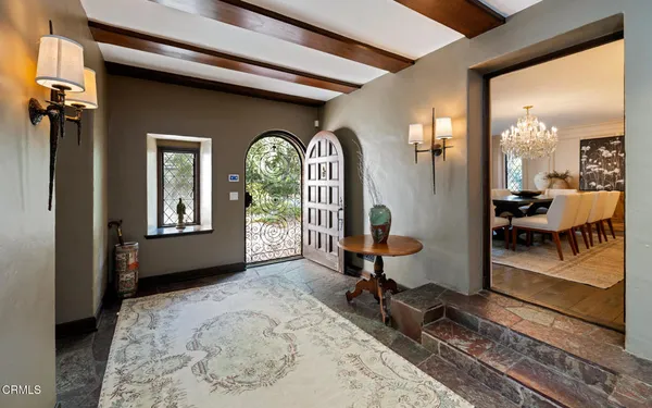 a view of a dining room with furniture and window