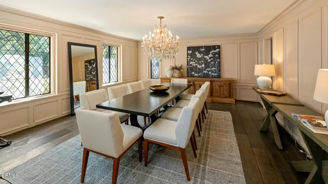 a living room with lots of furniture and a chandelier