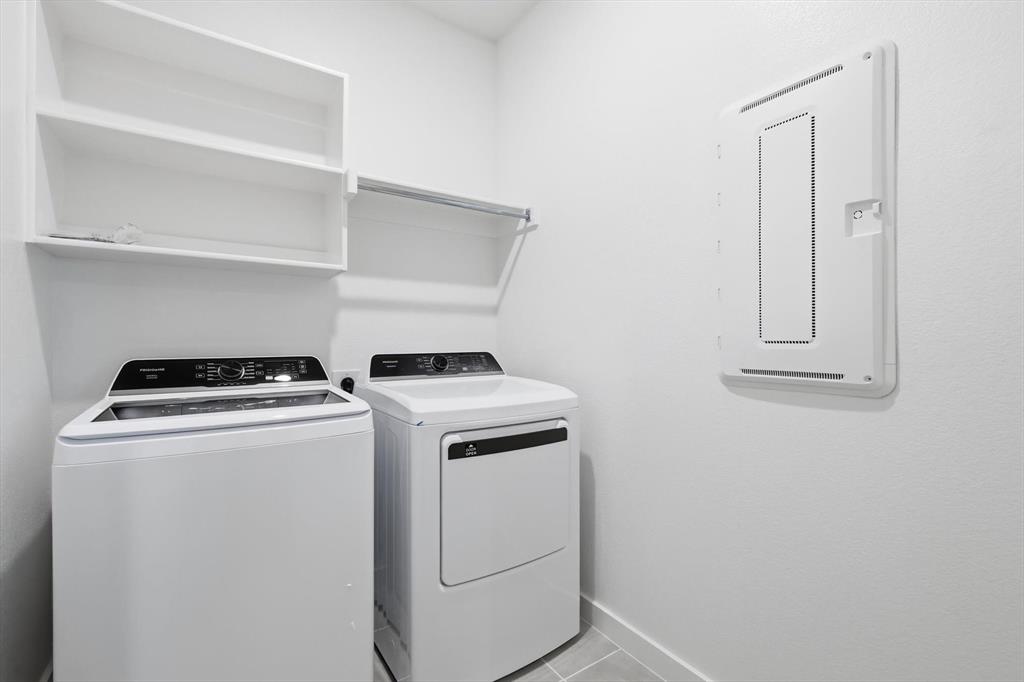 14908 Dust Storm Trail Haslet, TX 76052 - Photo 17 of 20 a view of storage and utility room with washer and dryer