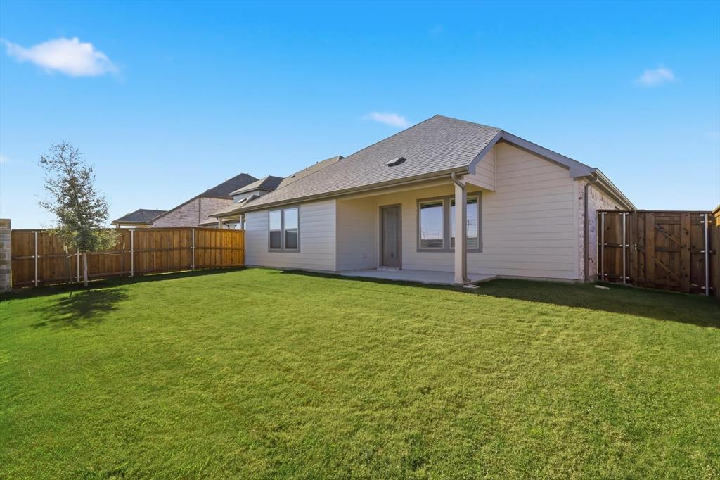 14908 Dust Storm Trail Haslet, TX 76052 - Photo 20 of 20 a view of a backyard with a garden