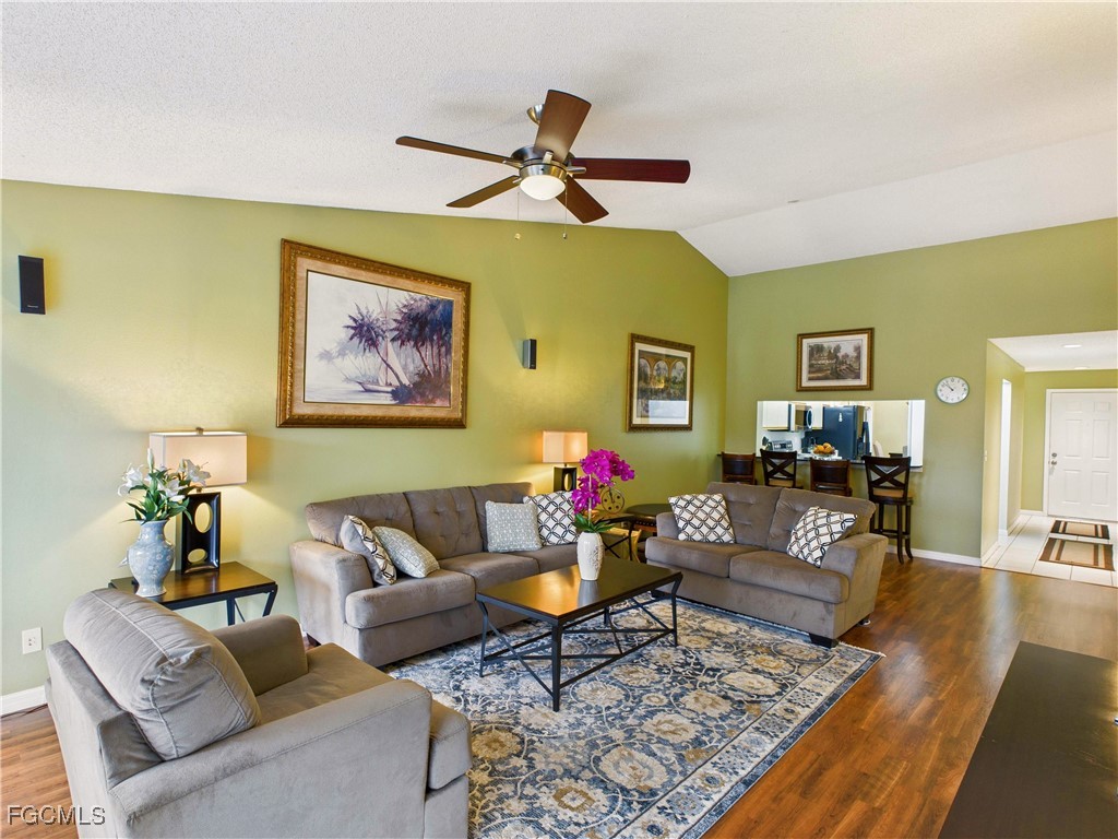 1290 Yesica Ann Circle, Unit G204 Naples, FL 34110 - Photo 11 of 21 a living room with furniture and wooden floor