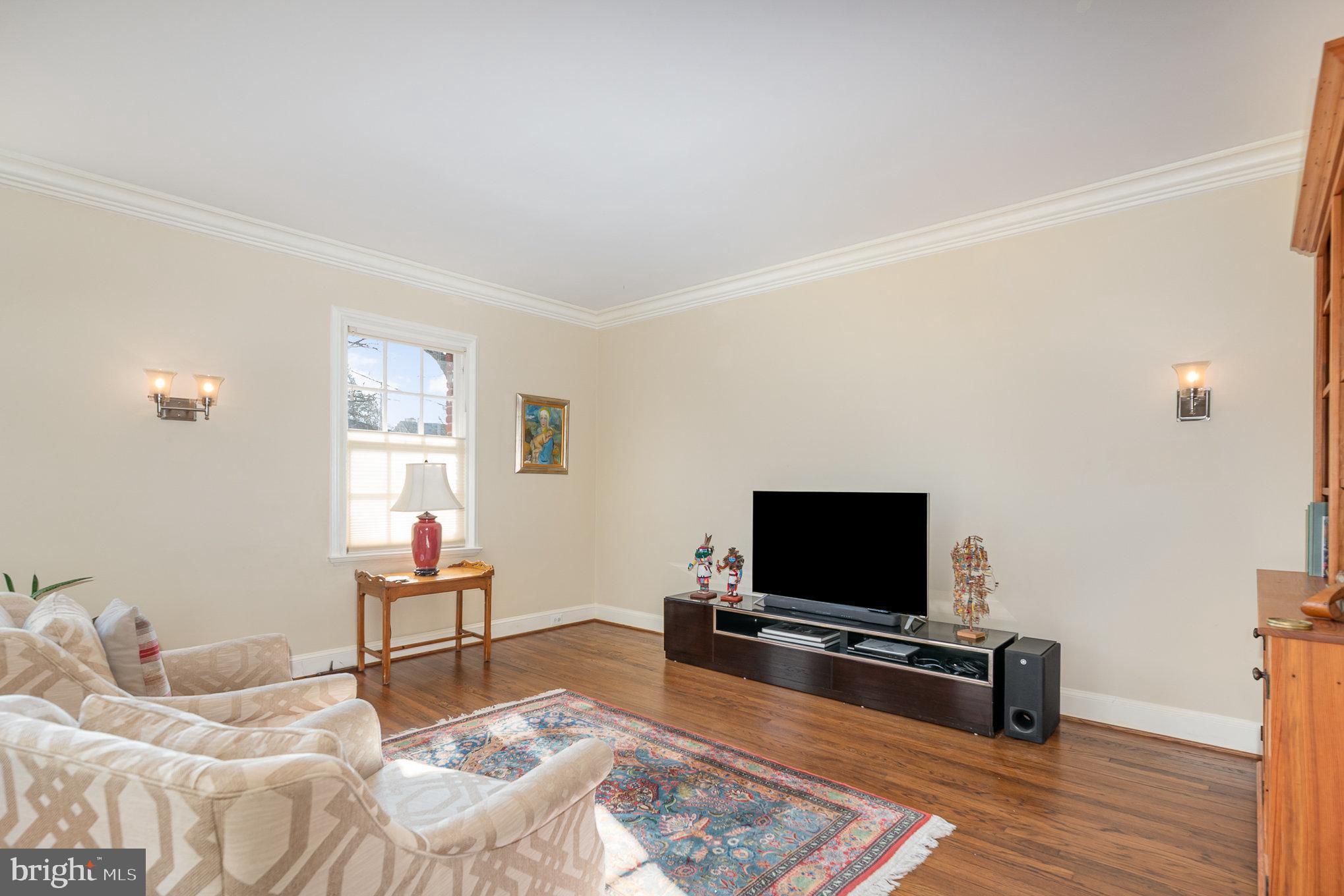 6 Upland Road, Unit F3 Baltimore, MD 21210 - Photo 7 of 27 a living room with furniture and a flat screen tv