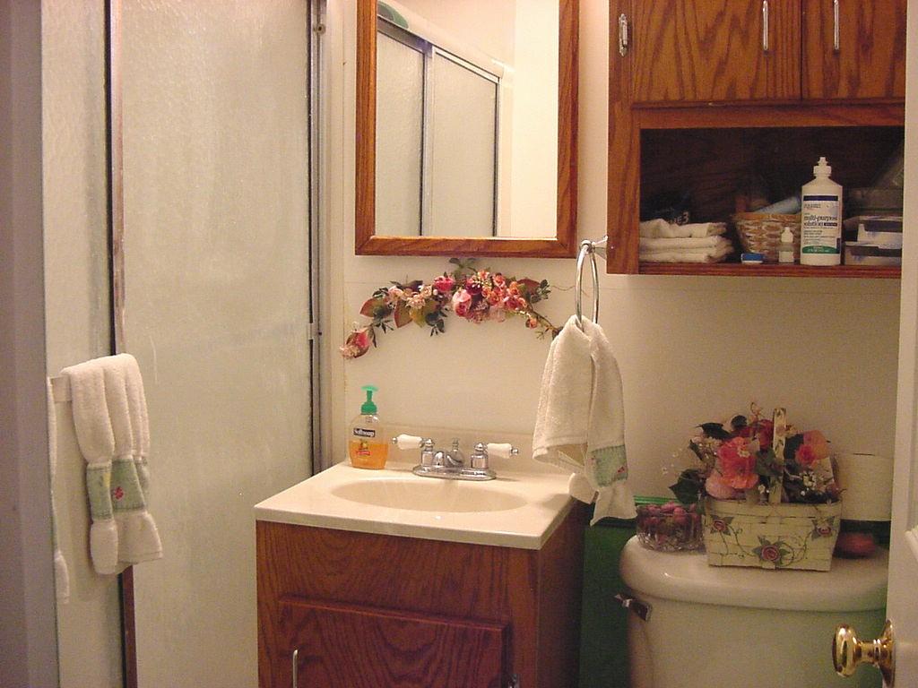 301 Southwest 45th Avenue Amarillo, TX 79110 - Photo 16 of 19 a bathroom with a sink vanity and a mirror