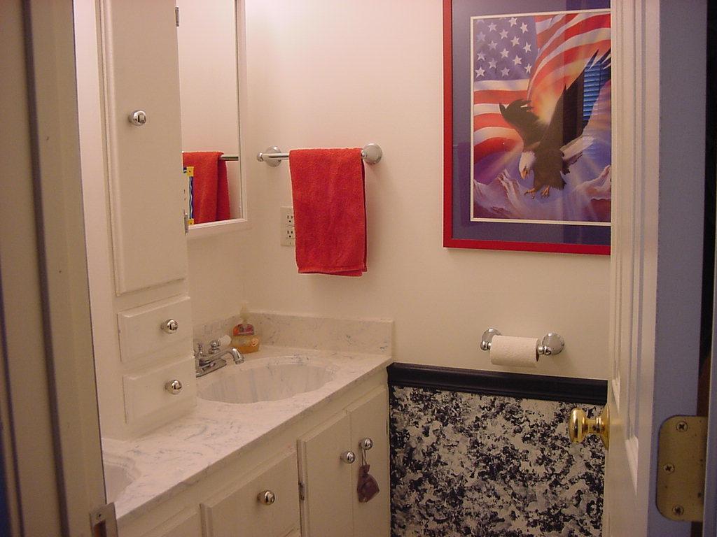 301 Southwest 45th Avenue Amarillo, TX 79110 - Photo 19 of 19 a bathroom with a sink and a mirror