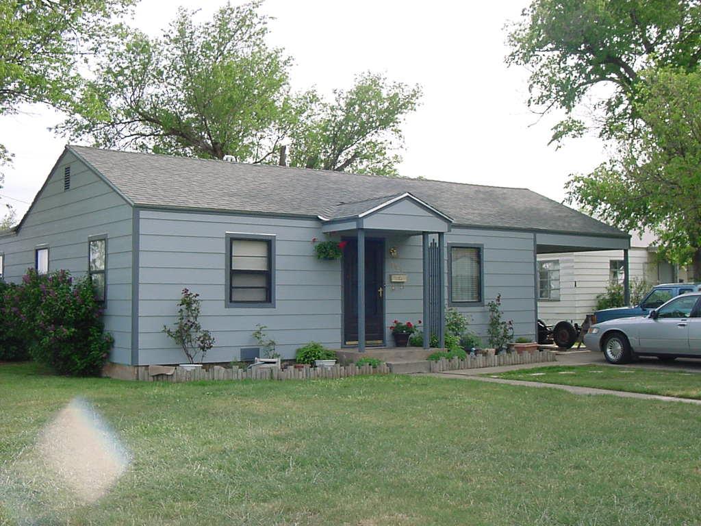 301 Southwest 45th Avenue Amarillo, TX 79110 - Photo 2 of 19 a view of a house with a yard and plants
