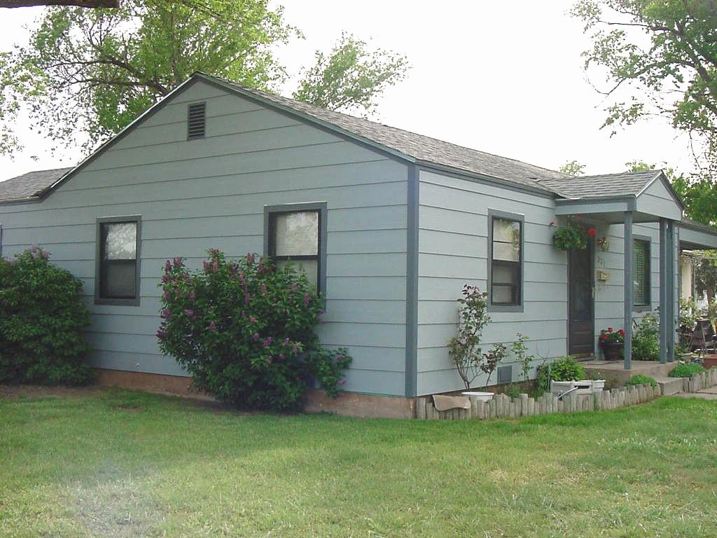 301 Southwest 45th Avenue Amarillo, TX 79110 - Photo 3 of 19 a front view of a house with a garden