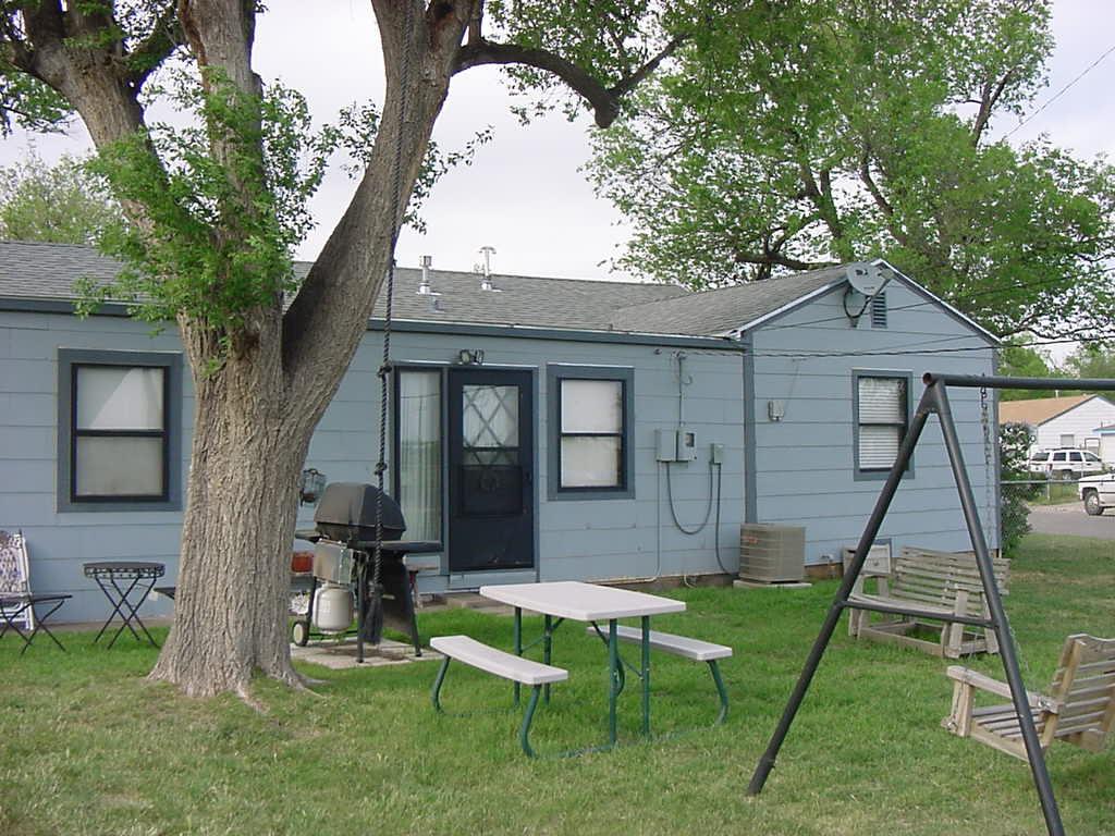 301 Southwest 45th Avenue Amarillo, TX 79110 - Photo 7 of 19 a view of a house with a backyard