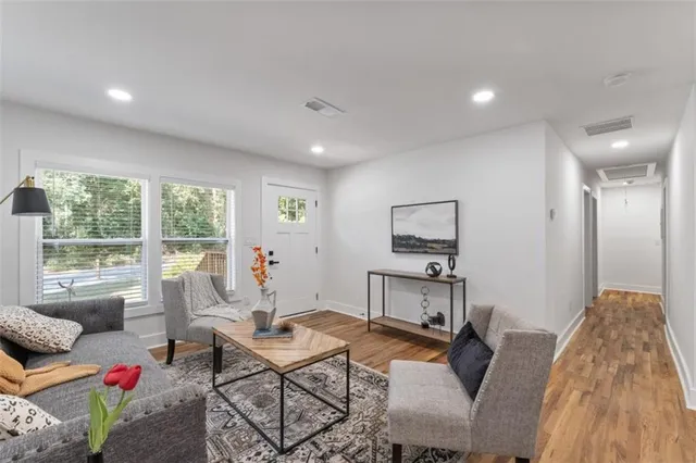 a living room with furniture and a large window