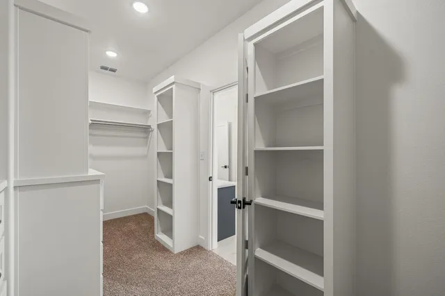 a view of an empty walk in closet