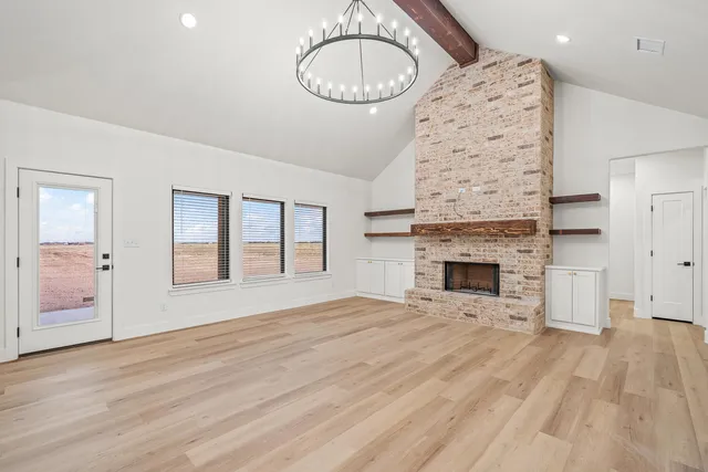 a kitchen with white cabinets sink and stove