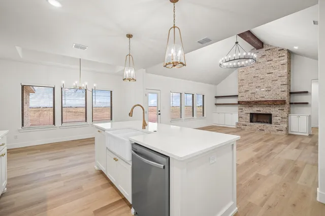 a view of house with yard and ocean view