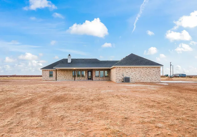 a view of a room with wooden walls