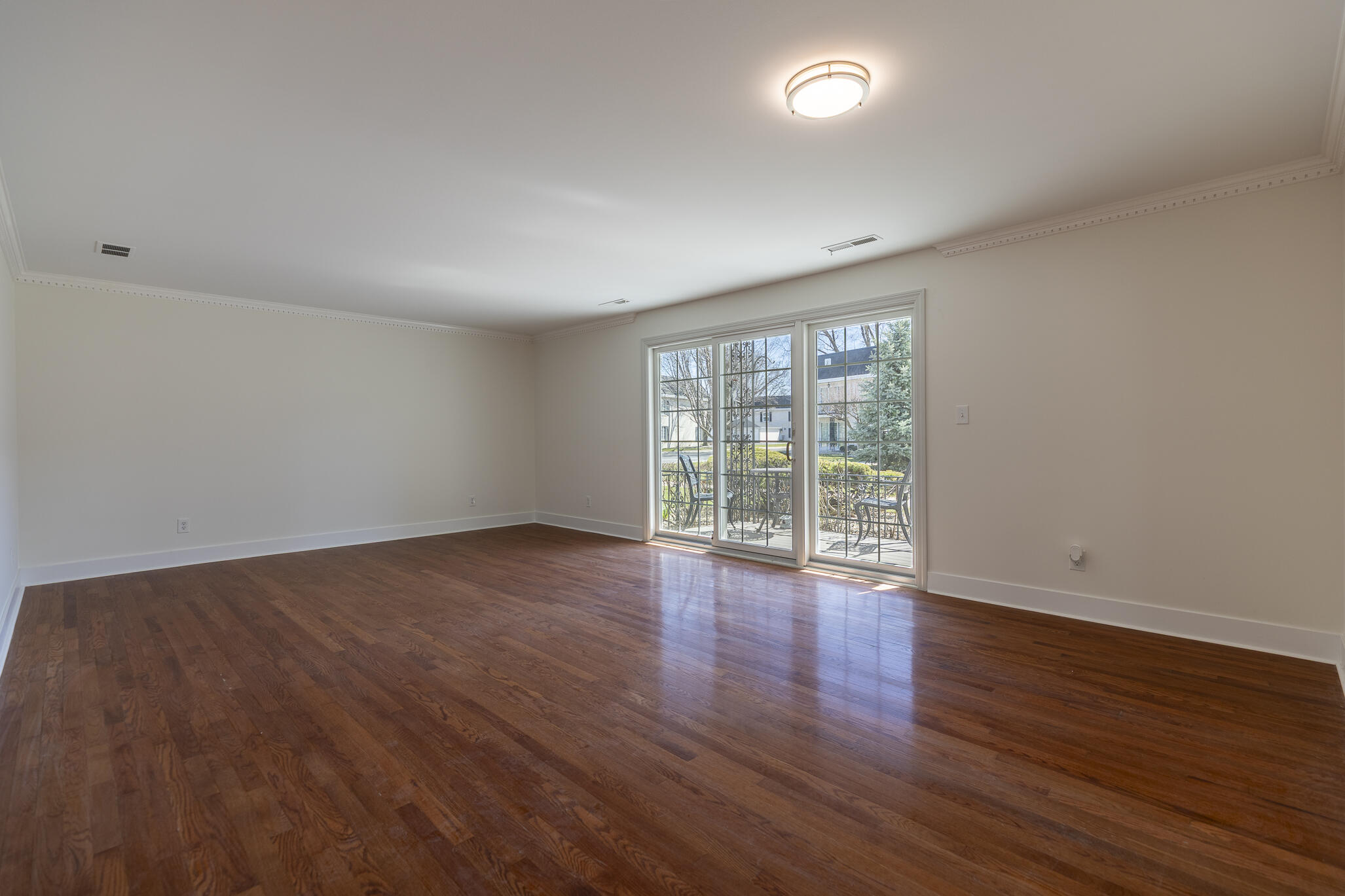 2255 Bordeaux, Unit B1 Highland, IN 46322 - Photo 18 of 49 a view of an empty room with wooden floor and a window