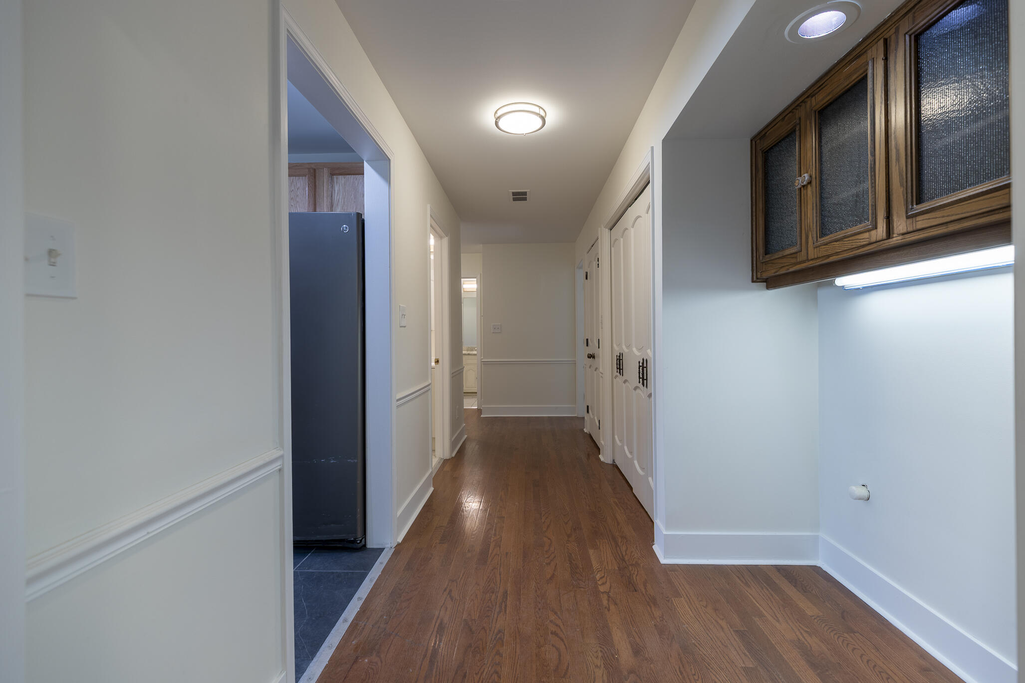 2255 Bordeaux, Unit B1 Highland, IN 46322 - Photo 29 of 49 a view of a hallway with wooden floor