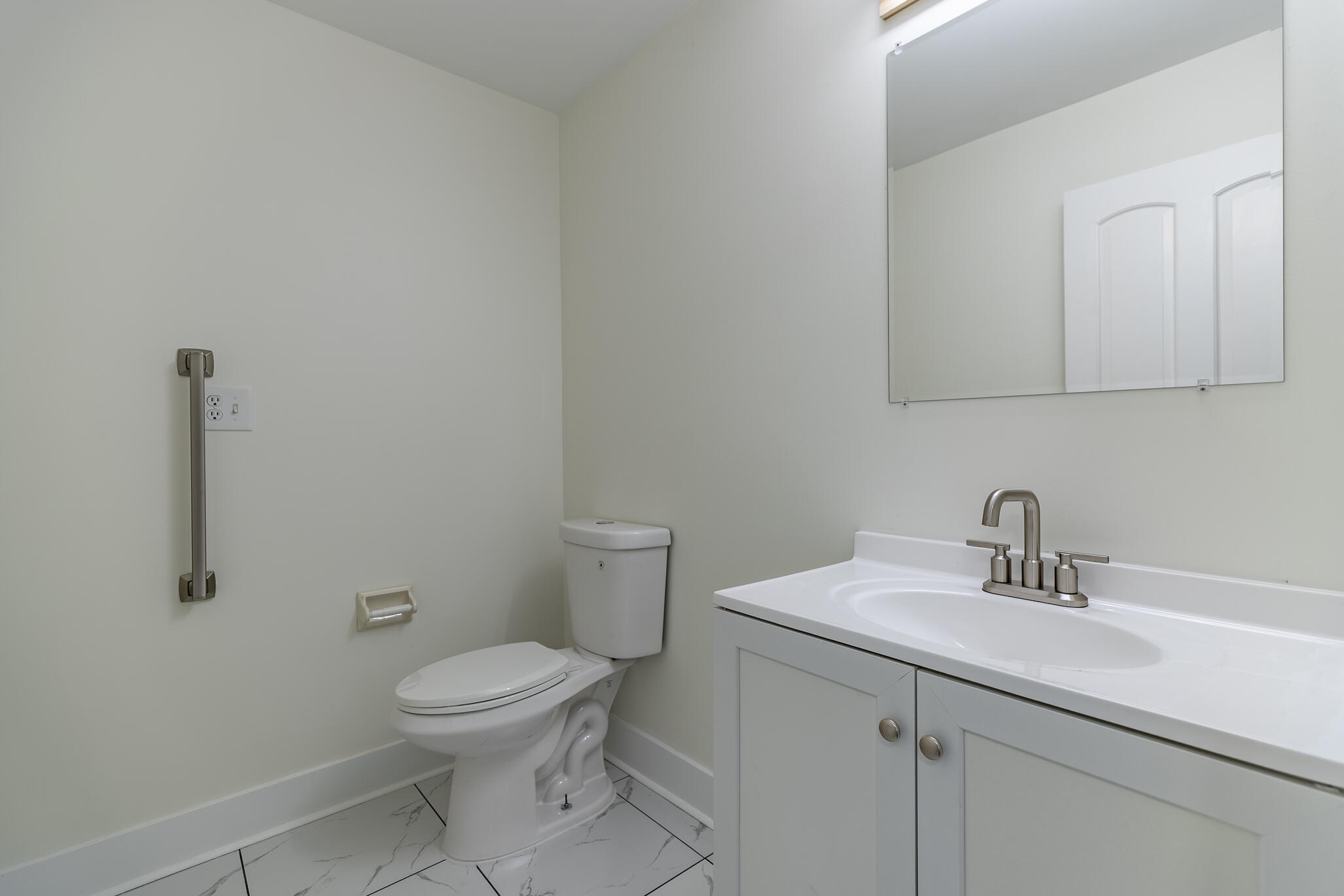 2255 Bordeaux, Unit B1 Highland, IN 46322 - Photo 31 of 49 a bathroom with a toilet a sink and mirror