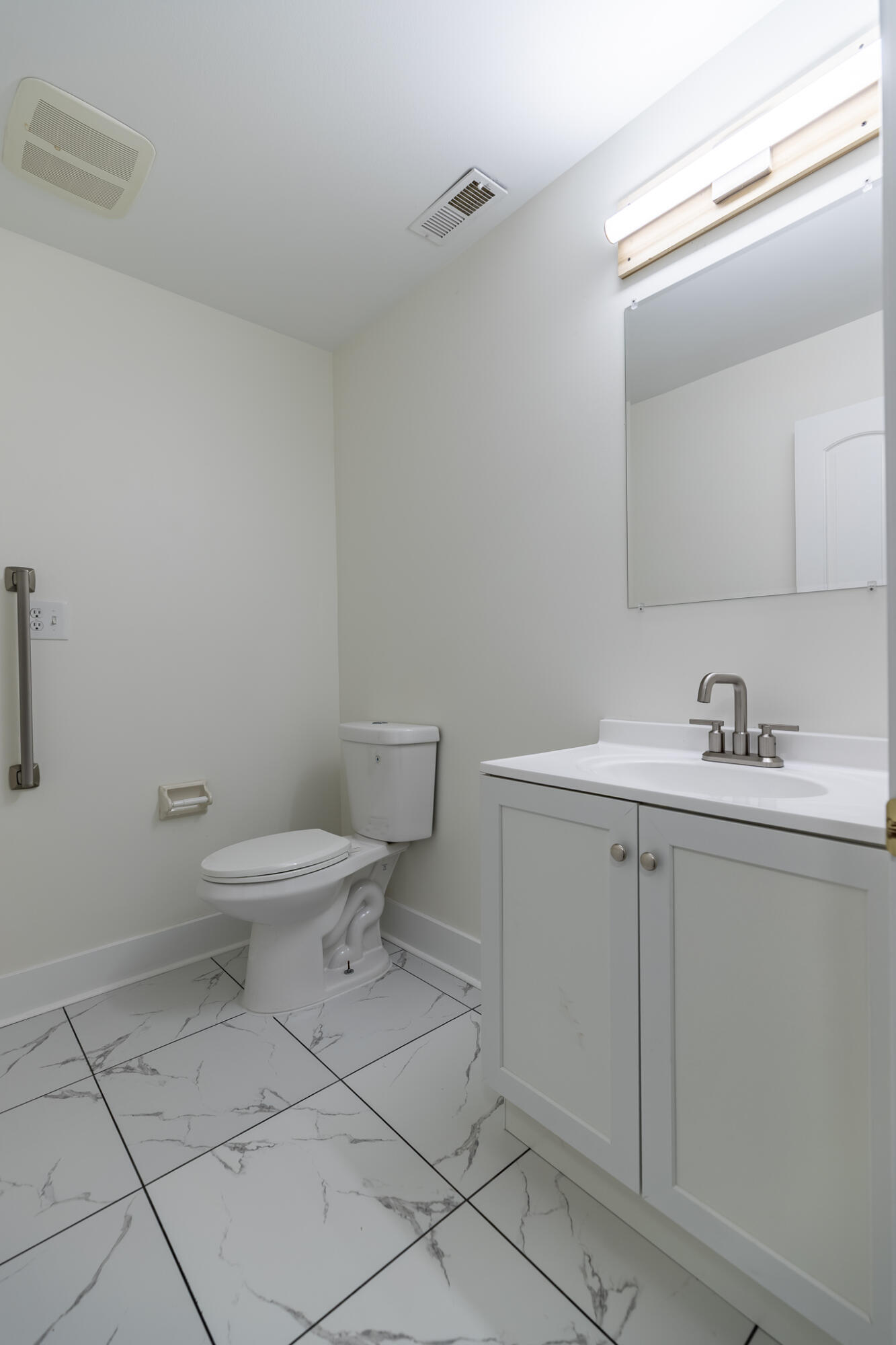 2255 Bordeaux, Unit B1 Highland, IN 46322 - Photo 32 of 49 a bathroom with a toilet sink and mirror
