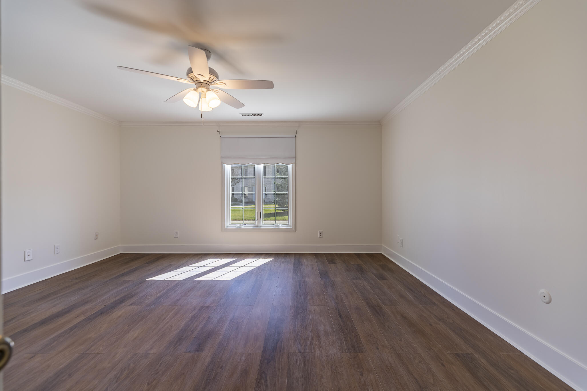 2255 Bordeaux, Unit B1 Highland, IN 46322 - Photo 35 of 49 an empty room with wooden floor chandelier fan and windows