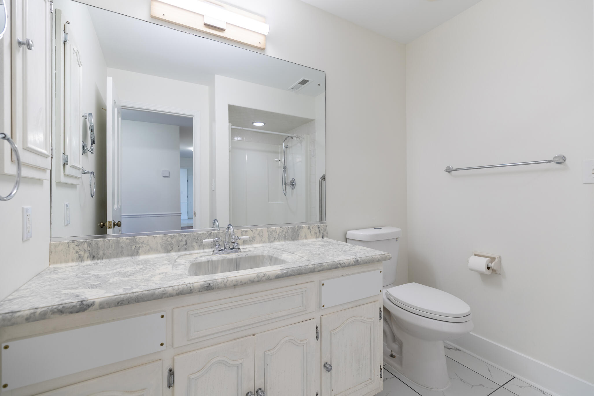 2255 Bordeaux, Unit B1 Highland, IN 46322 - Photo 45 of 49 a bathroom with a granite countertop toilet sink vanity and mirror