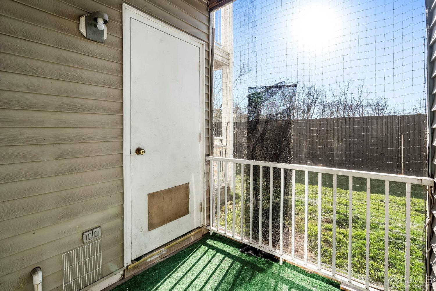 1211 Edpas Road New Brunswick, NJ 08901 - Photo 14 of 25 a view of a balcony with a floor to ceiling window