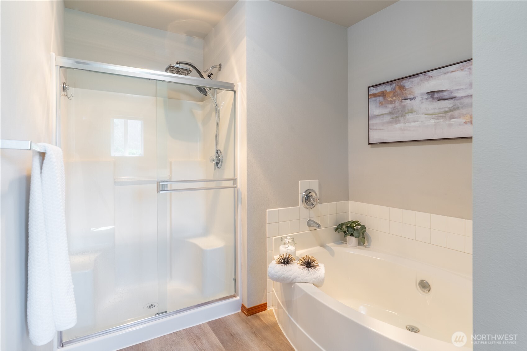 242 Riggs Drive East Enumclaw, WA 98022 - Photo 27 of 40 a bathroom with a bathtub and a shower