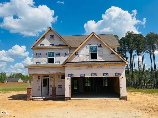 a kitchen with stainless steel appliances kitchen island granite countertop a stove a sink and a microwave