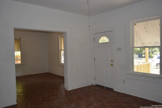 an empty room with windows