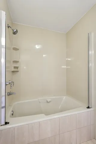 a bathroom with a bathtub and a sink