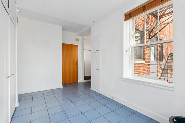 a view of a patio with chairs and tables
