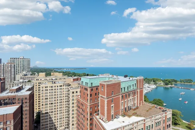 an aerial view of a residential building with an outdoor space