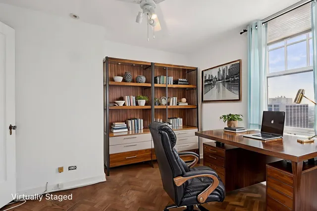 a spacious bedroom with a large bed and windows