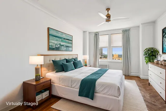 a bedroom with a large bed and a window