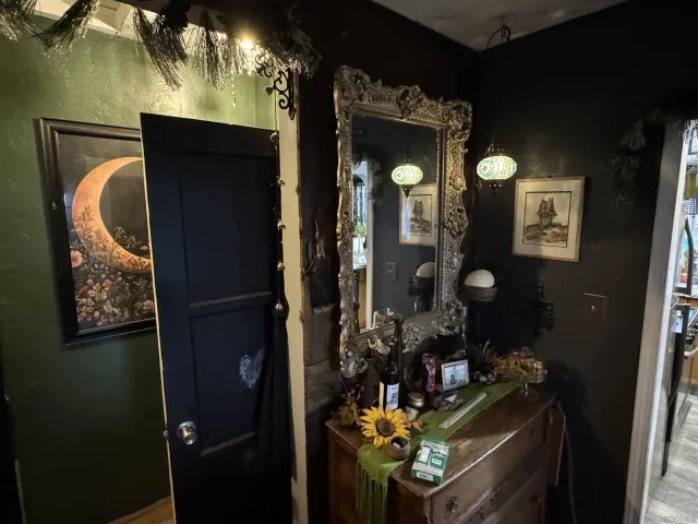 a living room with furniture a flat screen tv and a large window