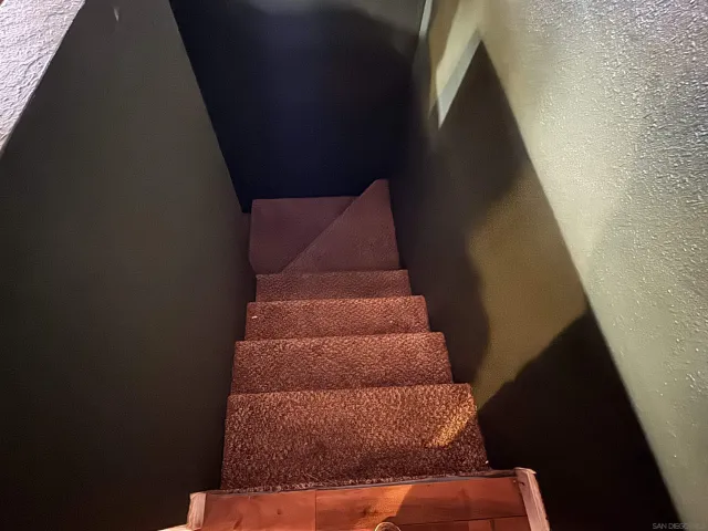 a room with furniture and flat screen tv