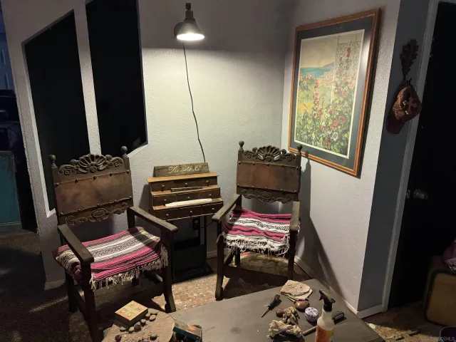 a bedroom with a bed and a mirror