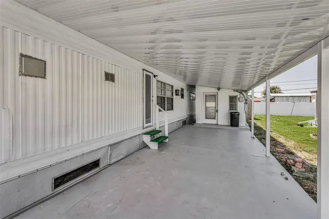 a view of a porch with hardwood