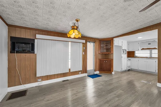 a view of a kitchen with a sink and a refrigerator