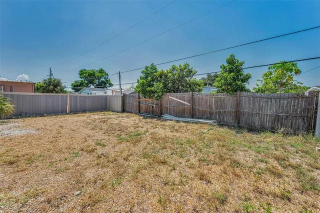a view of small space with wooden fence
